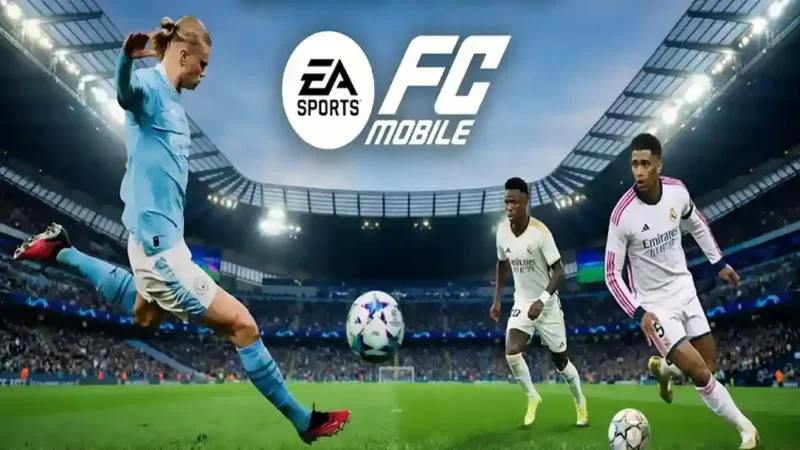 شاشة ترحيبية للعبة EA SPORTS FC MOBILE يظهر فيها شعار اللعبة بوضوح في الأعلى. في الملعب أدناه، يظهر إيرلينج هالاند وهو يركل الكرة بقميص مانشستر سيتي، وإلى جانبه بيلينغهام وفينيسيوس جونيور بقميص ريال مدريد، مما يمثل نجوم واجهة اللعبة الجدد.